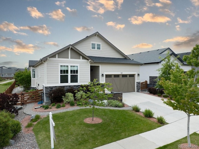 565 Pikes View Dr, Erie, CO 80516 - craftsman house featuring stone siding, an attached garage, and concrete driveway