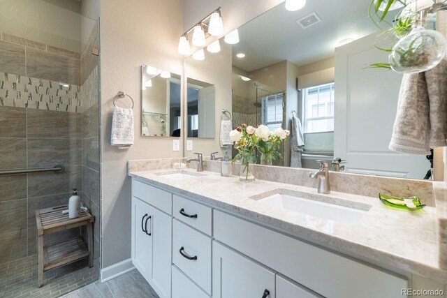 565 Pikes View Dr, Erie, CO 80516 - bathroom with double vanity and tiled shower