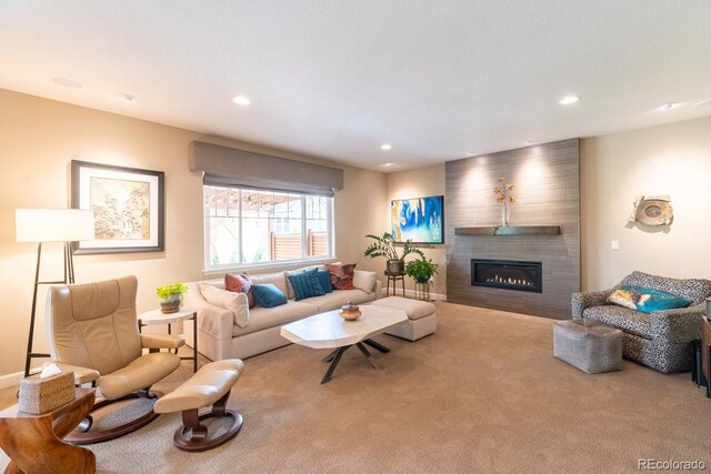 565 Pikes View Dr, Erie, CO 80516 - carpeted living area with a large fireplace and recessed lighting