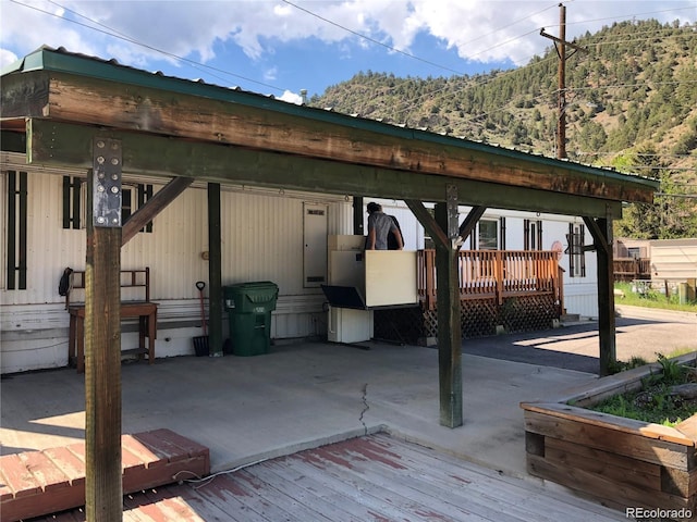 exterior space featuring a wooden deck