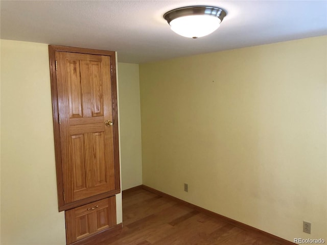 spare room with light hardwood / wood-style floors