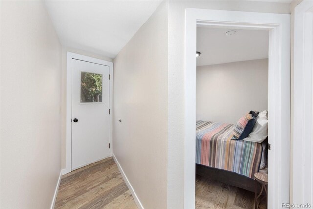 entryway featuring light wood-type flooring and baseboards