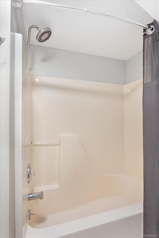 full bath featuring shower / bath combo