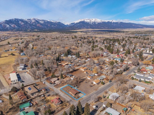 birds eye view of property featuring a mountain view