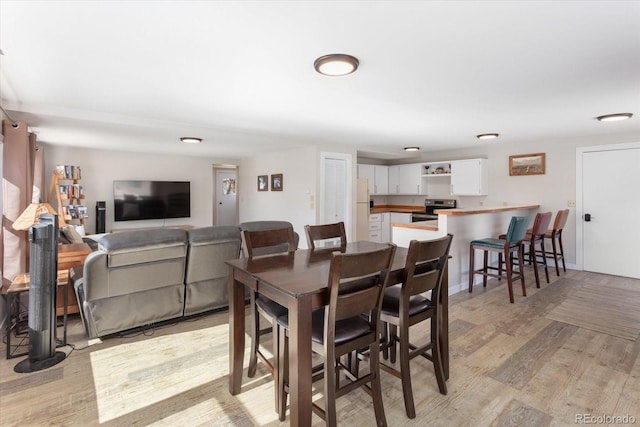 dining room featuring light wood-style floors