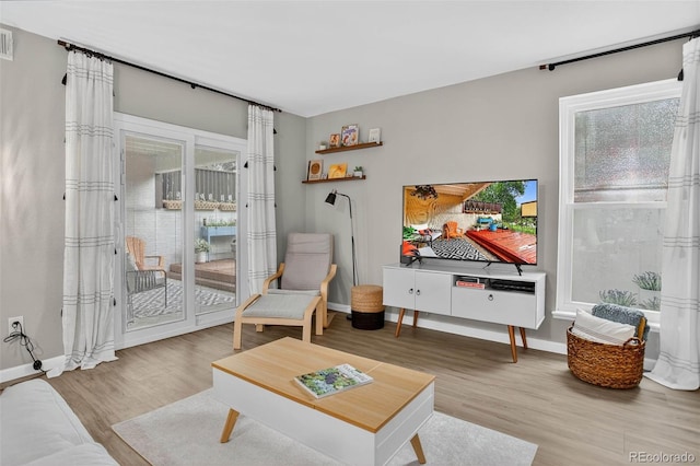 14934 E Hampden Cir Unit 3, Aurora, CO 80014 - living room with wood finished floors and healthy amount of natural light