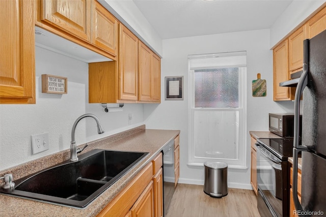 14934 E Hampden Cir Unit 3, Aurora, CO 80014 - kitchen featuring black appliances, light wood-style floors, and extractor fan