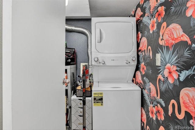 14934 E Hampden Cir Unit 3, Aurora, CO 80014 - laundry room with stacked washer / dryer