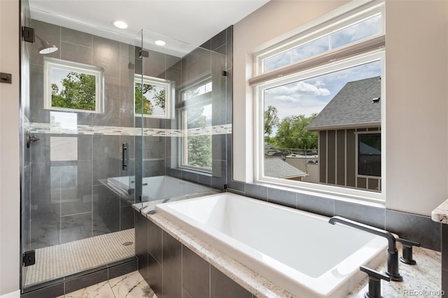 bathroom featuring plus walk in shower