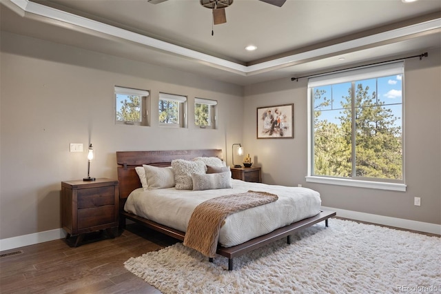 1803 Avenida Del Sol, Castle Rock, CO 80104 - bedroom with recessed lighting, dark wood-style flooring, a tray ceiling, and ceiling fan