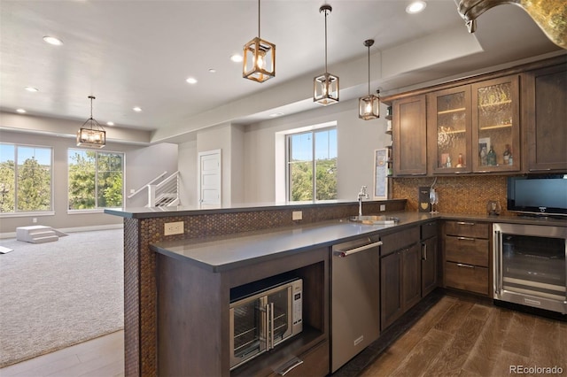 1803 Avenida Del Sol, Castle Rock, CO 80104 - kitchen featuring beverage cooler, stainless steel dishwasher, dark countertops, recessed lighting, and open floor plan