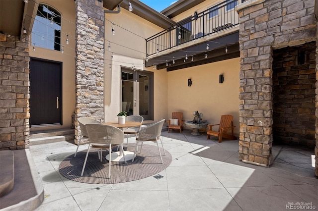 1803 Avenida Del Sol, Castle Rock, CO 80104 - patio / terrace with french doors, a patio, and outdoor dining area