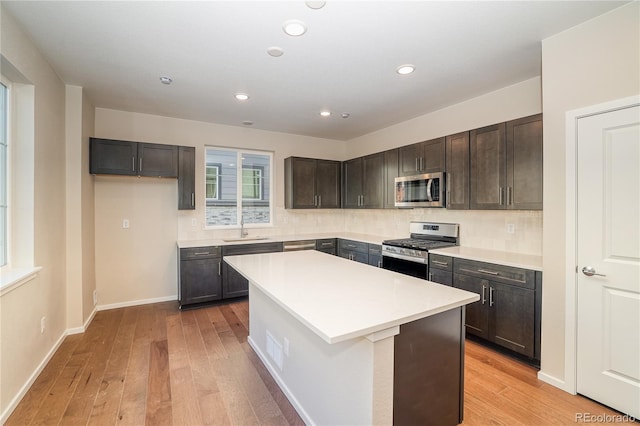 23931 E 40th Ave, Aurora, CO 80019 - kitchen with stainless steel appliances, light wood-style floors, decorative backsplash, and recessed lighting