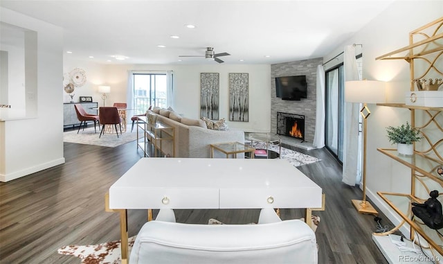 800 Pearl St Unit 1010, Denver, CO 80203 - living room featuring a stone fireplace, a ceiling fan, dark wood-type flooring, and recessed lighting
