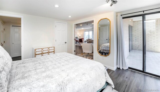 800 Pearl St Unit 1010, Denver, CO 80203 - bedroom featuring dark wood-type flooring, access to exterior, and recessed lighting