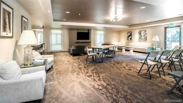 800 Pearl St Unit 1010, Denver, CO 80203 - living room featuring a tray ceiling, carpet floors, and recessed lighting