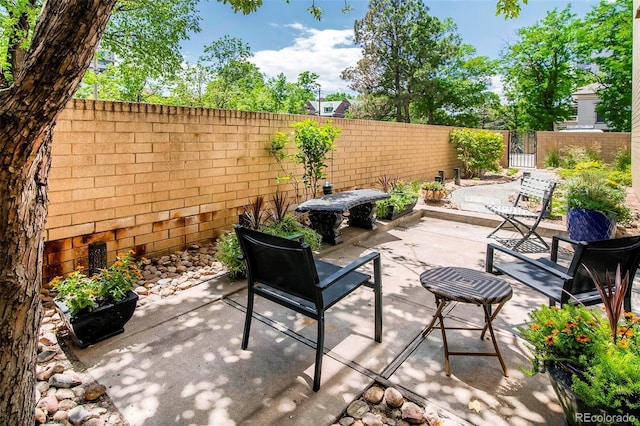 800 Pearl St Unit 1010, Denver, CO 80203 - fenced backyard featuring a patio area and a gate