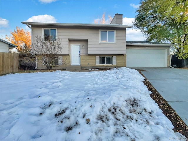 split foyer home featuring a garage