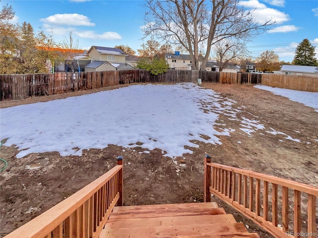 view of yard covered in snow