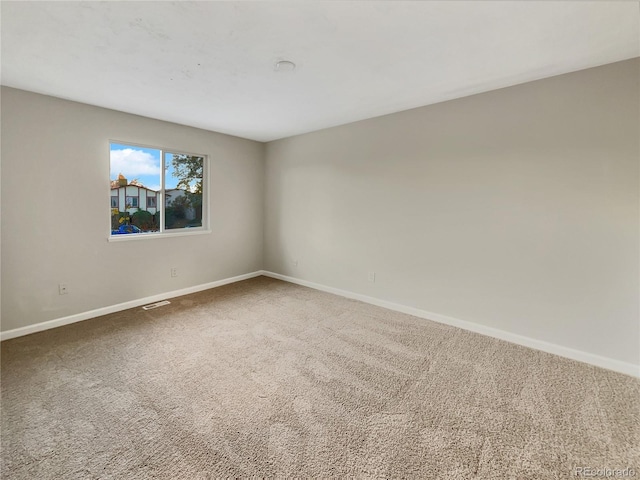 unfurnished room with carpet floors