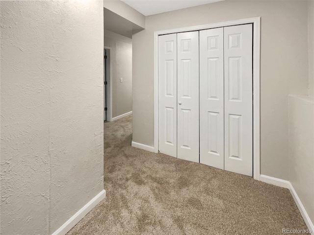 hall with carpet floors