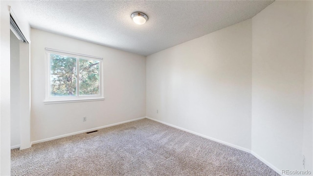 3732 Rosewalk Ct, Highlands Ranch, CO 80129 - carpeted spare room featuring a textured ceiling and baseboards