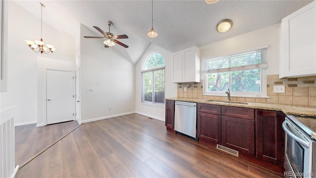 3732 Rosewalk Ct, Highlands Ranch, CO 80129 - kitchen with appliances with stainless steel finishes, dark wood-style flooring, a ceiling fan, light stone countertops, and backsplash