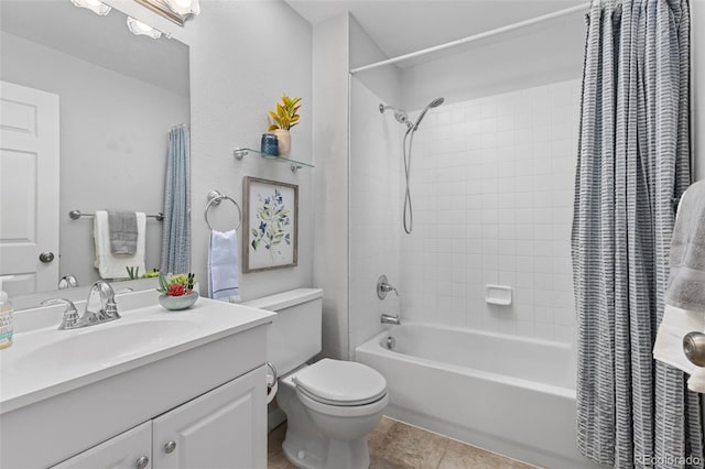 bathroom featuring tile patterned flooring, vanity, toilet, and shower / tub combo