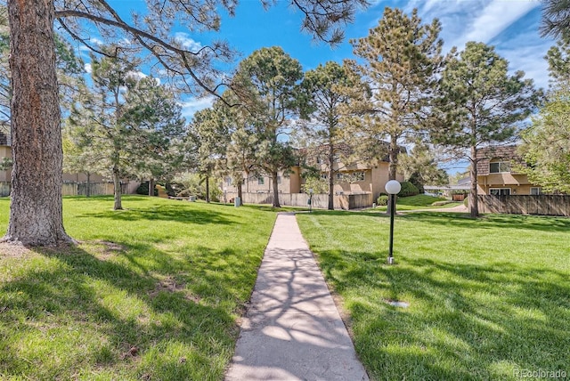 view of home's community with a lawn