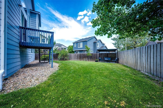 8930 Apache Plume Dr, Parker, CO 80134 - fenced backyard with a wooden deck, stairway, and an outdoor hangout area
