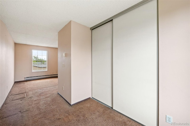 closet featuring baseboard heating