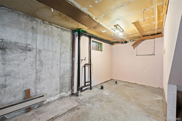 below grade area featuring a baseboard radiator