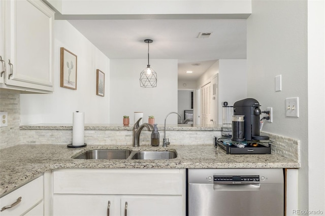 kitchen featuring light stone countertops, visible vents, a sink, white cabinets, and dishwasher