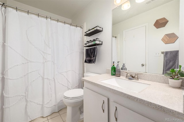 bathroom with tile patterned floors, toilet, and vanity