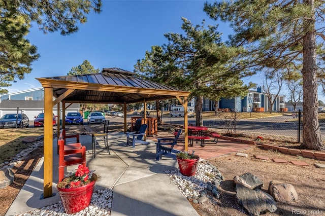 view of community with a gazebo and fence