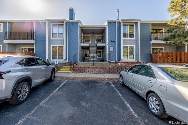 view of front facade with uncovered parking