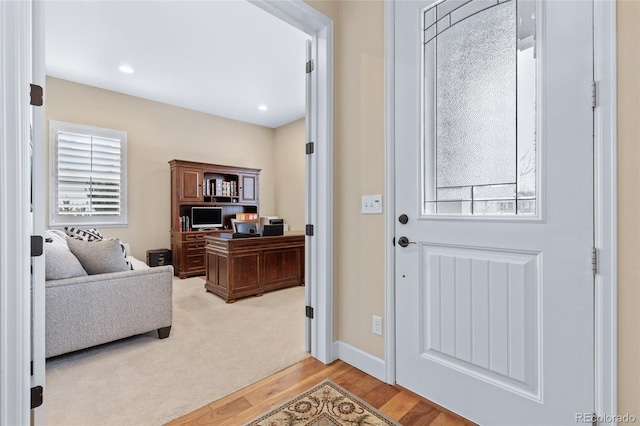 foyer with light wood-type flooring, plenty of natural light, baseboards, and recessed lighting