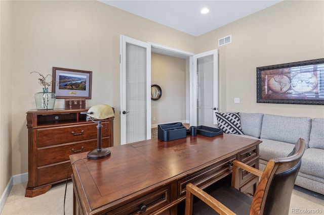 office space featuring recessed lighting, light colored carpet, visible vents, and baseboards