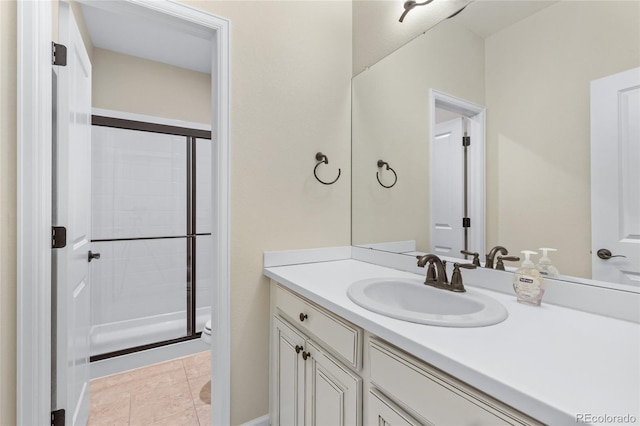 bathroom with toilet, a stall shower, tile patterned flooring, and vanity