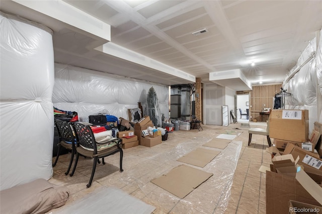 unfinished basement featuring visible vents