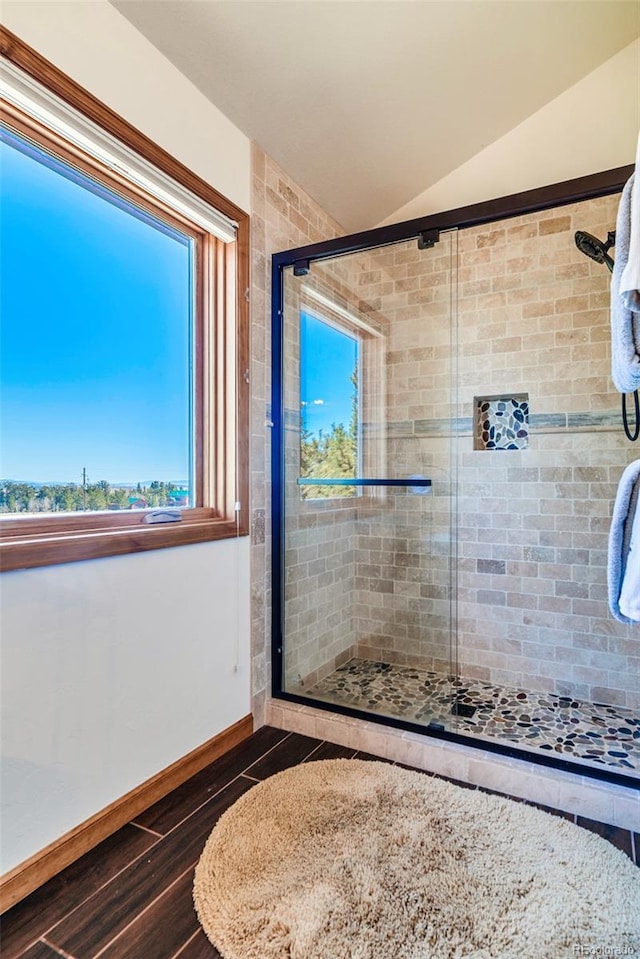 16 Thurber Ct, Fairplay, CO 80440 - bathroom featuring baseboards, wood finished floors, a stall shower, and vaulted ceiling