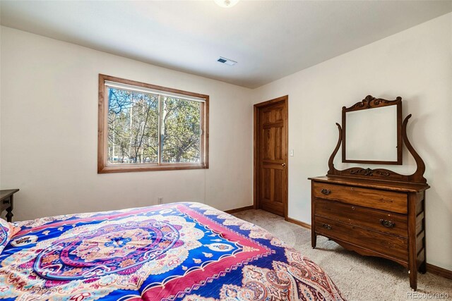 16 Thurber Ct, Fairplay, CO 80440 - bedroom featuring light carpet, visible vents, and baseboards
