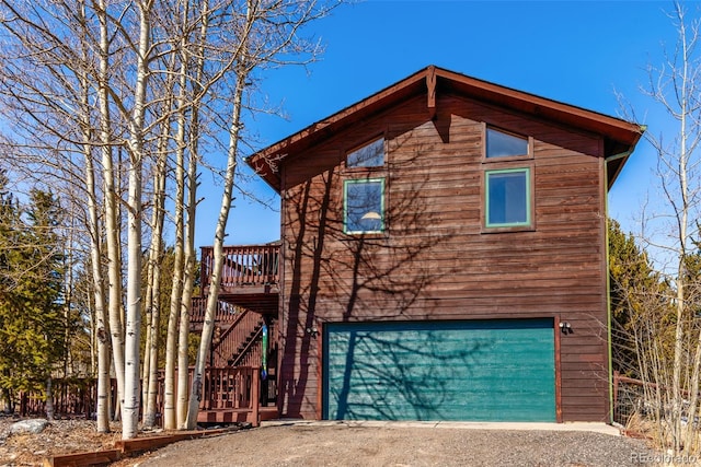 16 Thurber Ct, Fairplay, CO 80440 - rustic home featuring an attached garage and stairs