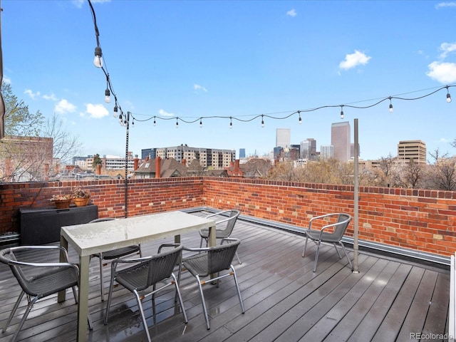 1130 N N Pennsylvania St Unit 306, Denver, CO 80203 - deck with outdoor dining area and a city view