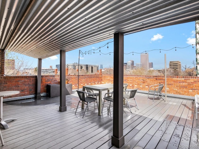 1130 N N Pennsylvania St Unit 306, Denver, CO 80203 - wooden terrace featuring outdoor dining area