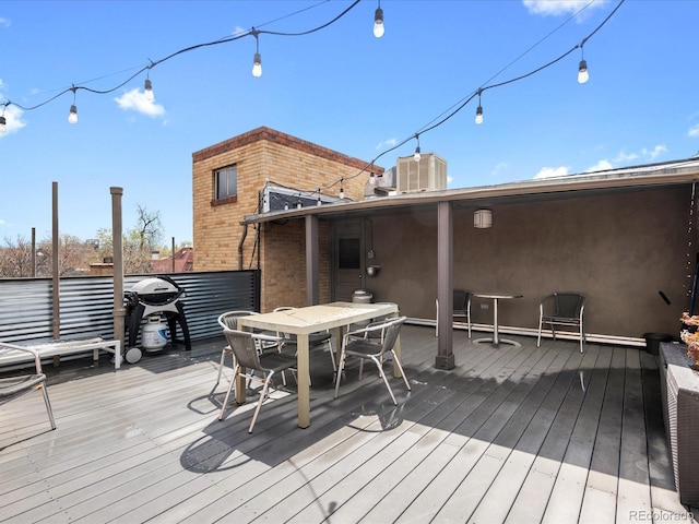 1130 N N Pennsylvania St Unit 306, Denver, CO 80203 - wooden deck featuring outdoor dining space