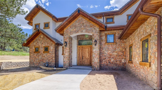 11790 Huckleberry Dr, Franktown, CO 80116 - entrance to property featuring stone siding and stucco siding