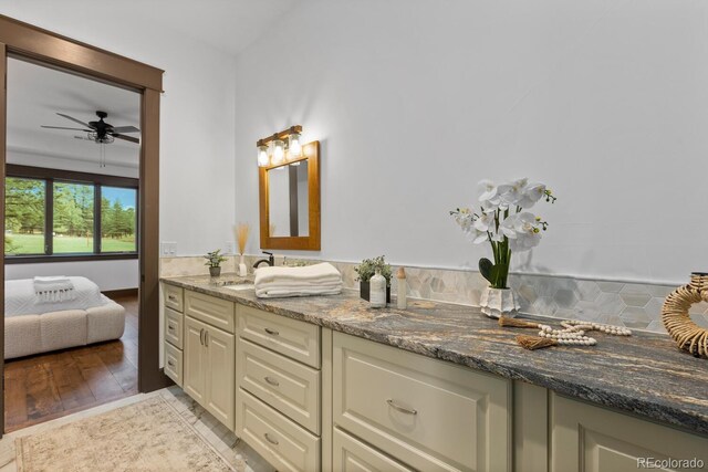 11790 Huckleberry Dr, Franktown, CO 80116 - ensuite bathroom with double vanity and ceiling fan
