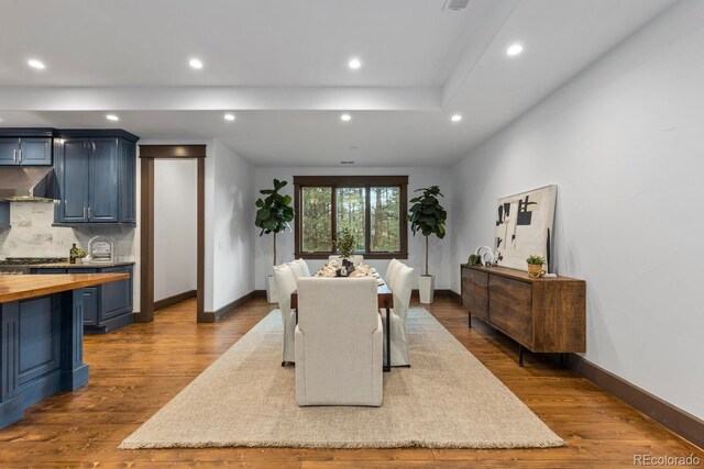 11790 Huckleberry Dr, Franktown, CO 80116 - dining room featuring recessed lighting, dark wood-style flooring, and baseboards
