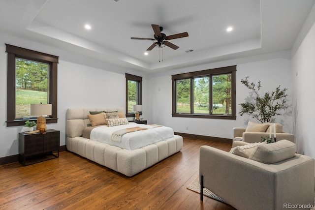 11790 Huckleberry Dr, Franktown, CO 80116 - bedroom featuring a raised ceiling, hardwood / wood-style floors, baseboards, recessed lighting, and ceiling fan